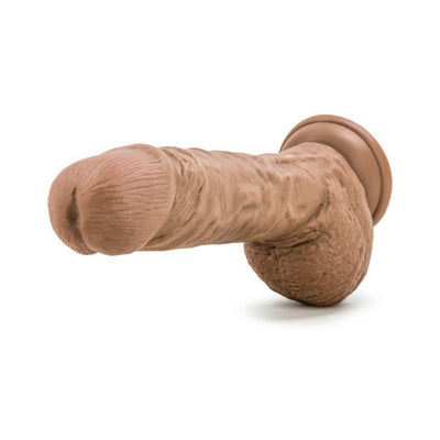 Realistic mocha-colored 9-inch dildo with textured skin, veining, and suction cup base for hands-free use.