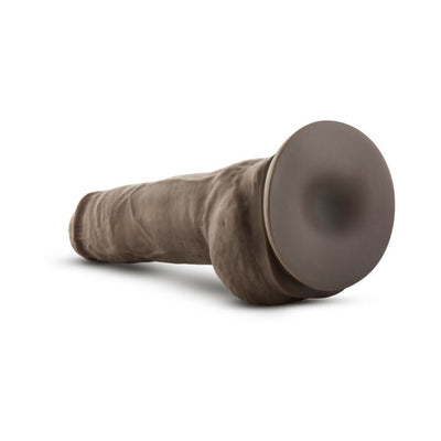 Realistic brown dual density dildo with suction cup base lying on white background