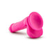 Pink realistic dildo with suction cup base and textured shaft, designed for comfort and versatility.