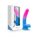 Avant Chasing Sunsets dildo in vibrant pink and blue gradient with subtle glitter, displayed next to its white and blue packaging.