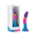 Colorful silicone dildo with curved design and suction base next to its white and blue Avant branded packaging.