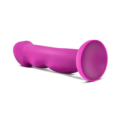 Sleek violet silicone toy with textured shaft and suction cup base, designed for versatile and comfortable use.