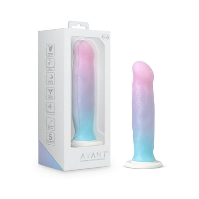 Blush Avant D17 Lucky dildo in pink, blue, and purple gradient with suction base next to its white packaging box.