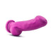 Ergonomically curved violet silicone dildo with suction cup base, hand-sculpted for a lifelike feel and versatile use.