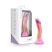 Blush Avant Sun's Out dildo in pink, purple, and orange hues with curved shape and suction cup base next to white packaging box.