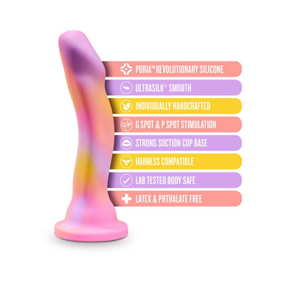 Pink and purple curved dildo with suction cup base and colorful labels highlighting features like body-safe silicone and harness compatibility.