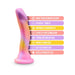 Pink and purple curved dildo with suction cup base and colorful labels highlighting features like body-safe silicone and harness compatibility.