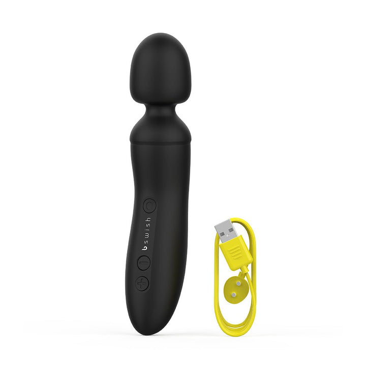 Black B Swish Bthrilled Premium cordless wand massager with ergonomic handle and yellow magnetic USB charging cable.