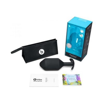 B Vibe Snug Plug 7 black silicone weighted plug with storage pouch, user guide, and packaging box.