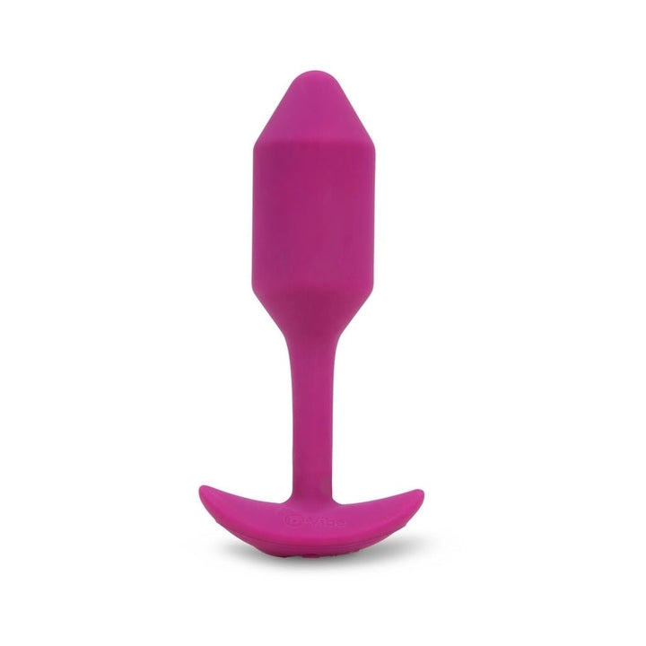 Medium-sized rose-colored silicone vibrating plug with tapered tip and curved base for comfortable wear.