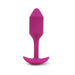 Medium-sized rose-colored silicone vibrating plug with tapered tip and curved base for comfortable wear.
