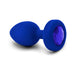 Blue sapphire vibrating plug with smooth silicone body and faceted jewel base, USB rechargeable and ergonomic design.