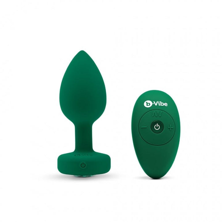 Green silicone vibrating jewel plug with matching remote control on white background