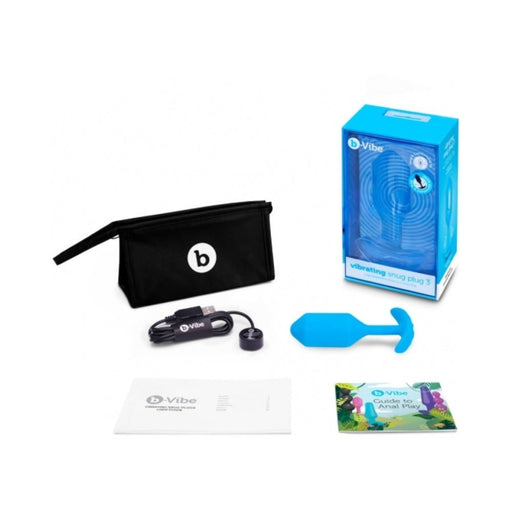 b-Vibe Vibrating Snug Plug 3 with USB charger, black storage pouch, user manuals, and blue silicone plug in packaging.