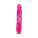 Pink translucent realistic vibrator with textured shaft and twist dial base for adjustable vibration.