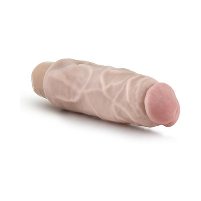 Beige realistic textured vibrator with a rounded tip and twist dial base on a white background.