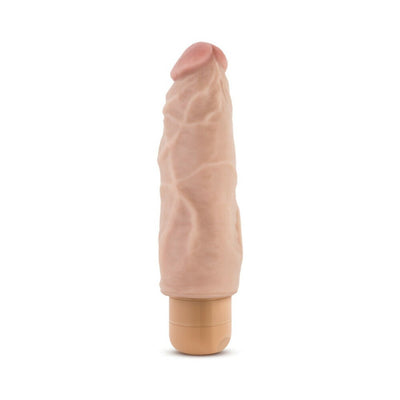 Beige realistic textured vibrator with multispeed waterproof twist dial base standing upright on white background.
