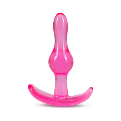 Pink translucent curvy anal plug with ergonomic base designed for comfort and safety.