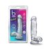 Clear 7-inch realistic dildo with suction cup base displayed next to its colorful retail packaging.