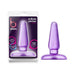 Medium-sized purple tapered anal plug with flexible base, shown in packaging and standalone.