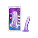 Purple translucent curved dildo with suction cup base next to its blue and purple branded packaging.