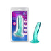 Teal translucent curved dildo with suction base next to its blue and purple packaging labeled B Yours Plus Hard 'n' Happy.