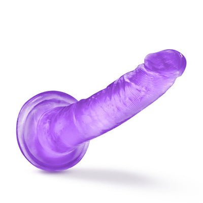 Purple translucent dildo with suction cup base and slight curve for targeted stimulation.