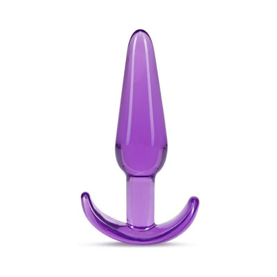Purple slim tapered anal plug with ergonomic curved base, made from smooth translucent material.