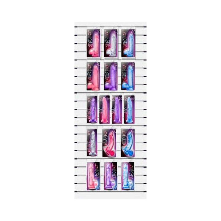 Display of B Yours Small Blush Savings Bundle with colorful packaged toys in pink, purple, blue, and clear on a white slatwall panel.