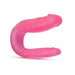 Pink U-shaped double-ended dildo with realistic texture and two different-sized ends for versatile use.
