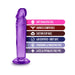 Purple 6-inch realistic dildo with suction cup base and text highlighting soft feel, harness compatibility, and body-safe materials.