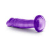 Purple 6-inch translucent dildo with suction cup base lying on white background.