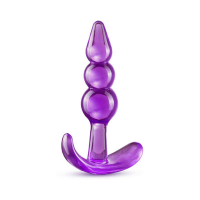 Purple triple bead anal plug with curved base for comfort and safety, made from smooth, flexible material.