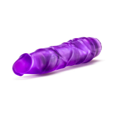 Purple translucent realistic vibrator with textured shaft and twist dial base on white background