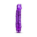 Purple translucent vibrator with textured shaft and prominent head, featuring a twist dial base for adjustable vibrations.