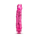 Pink translucent vibrator with textured shaft and rounded tip, featuring a twist dial base for adjustable vibrations.