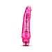 Pink translucent realistic textured vibrator with tapered tip and twist dial base.