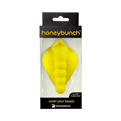 Banana Pants Honeybunch silicone grinder in sunshine yellow, packaged in clear and black box with branding.