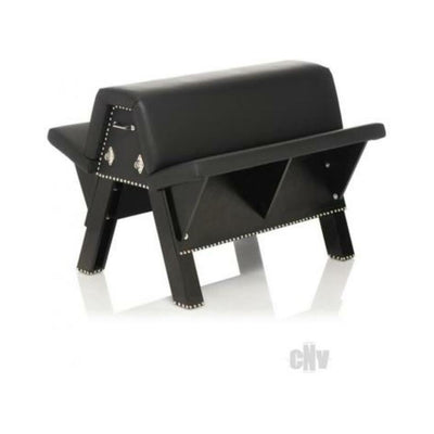 Black faux leather bondage bench with sturdy wooden legs and metal studs, designed for versatile restraint and comfort.