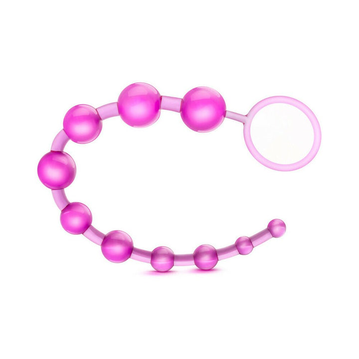 Purple flexible anal beads with graduated sizes and a loop handle for easy use and retrieval.