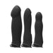 Three black silicone strap-on attachments in varying shapes and sizes designed for versatile pleasure.