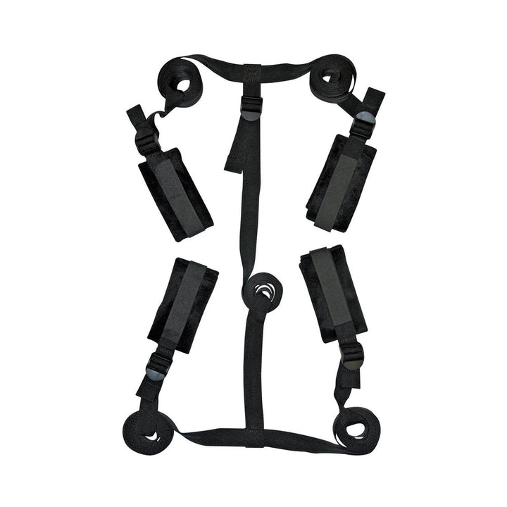 Black adjustable bed restraint kit with four padded cuffs and connecting straps laid flat on white background.
