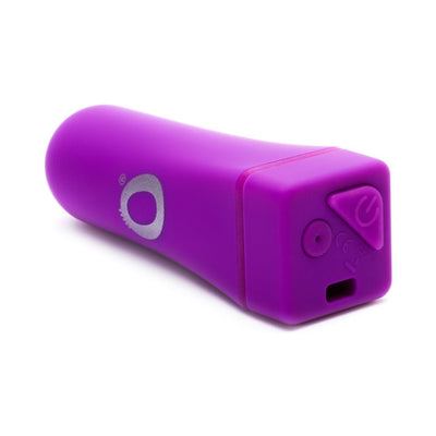 Compact purple rechargeable bullet vibrator with power button and USB charging port on a white background.