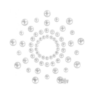 Circular arrangement of small and large white pearl pasties on a white background