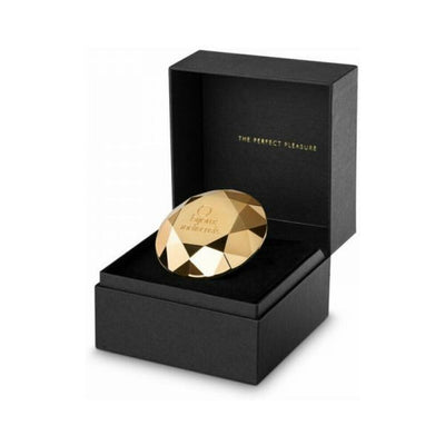 Gold faceted diamond-shaped vibrator in a black gift box with satin lining and "The Perfect Pleasure" text inside.