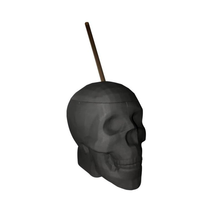 Black matte skull-shaped drinking cup with matching straw, perfect for themed parties and Halloween decor.