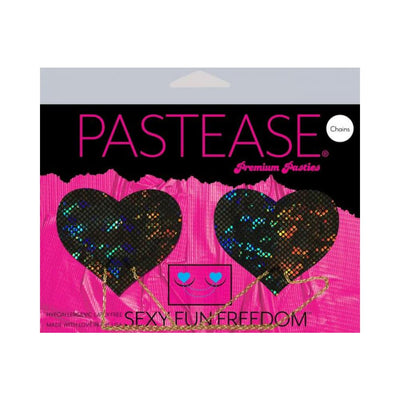 Black shattered disco ball heart-shaped pasties with gold chains on bright pink Pastease packaging.