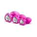Three pink silicone heart-based plugs in small, medium, and large sizes with white gem accents on a white background.