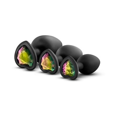 Set of three black silicone plugs in small, medium, and large sizes with heart-shaped bases featuring iridescent gems.