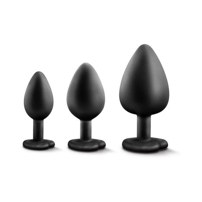 Three black silicone tapered plug trainers in small, medium, and large sizes with heart-shaped bases on a white background.